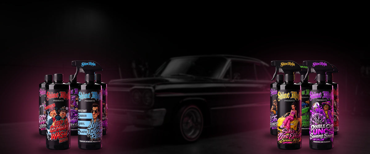 Two piles of Shine Mafia bottles glowing pink on either side of a black lowrider