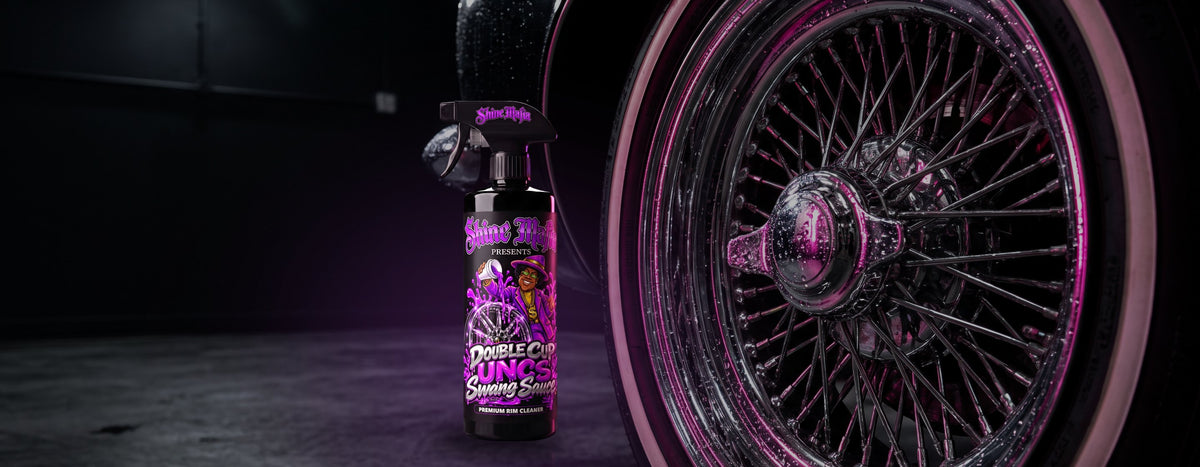UNC's Double Cup Swang Sauce standing in front of a chrome wire wheel