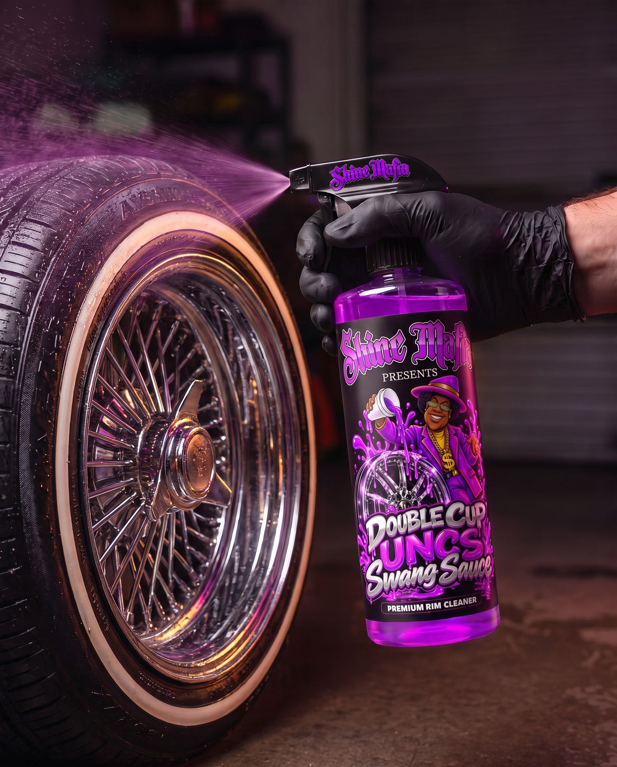 Spraying UNC's Double Cup Swang Sauce on a chrome wire wheel